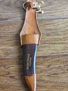 Original Buffalo Skinner knife from Silver Springs Florida with imitation bone handle and leather sheath.