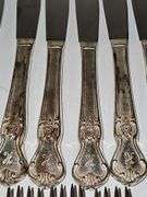 Old company plate flatware possibly Signature Rose pattern. 12 dinner forks, 10 dinner knives six soup spoons 9 teaspoons monogrammed H. Circa 1940s