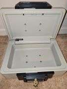 Sentry 1100 safe with key. Exterior dimensions 14 X 10.5 x 6.5 in tall.