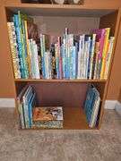 Bookcase and great grouping of children's books. Bookcase is 21.25 X 10.75 x 28.25 in tall. See all photos for titles.