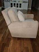 Tan manual rocker recliner. 30 x 33.5 x33 in tall. Seat height is 19 in.
