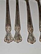 Old company plate flatware possibly Signature Rose pattern. 12 dinner forks, 10 dinner knives six soup spoons 9 teaspoons monogrammed H. Circa 1940s