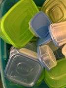 Tote full of plastic storage bowls