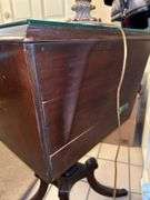 Antique mahogany Duncan-Phyfe style table with single drawer, pull-down compartment and claw feet (not brass)…..20 x 16 x 30 tall….does have glass overlay