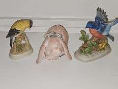 Lefton China goldfinch, unmarked bluebird, and terracotta look rabbit.