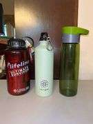 Selection of insulated drink containers and (1) glass sports bottle…..all are NEW and far right silver piece has a dent in the top and comes with carry case (see all pics as more were added) cups are by Primula