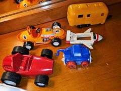 Toy vehicle grouping. Larger vehicles in the back are plastic, planes and General Lee cars or metal diecast.