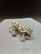 Great selection of vintage screw-back and clip-on earrings, along with a cylindrical gold tone brooch