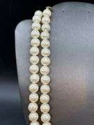 Nice looking double strand of pearl-like beads with adjustable fastener
