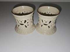 Three brass candlesticks and two Lenox tea lights