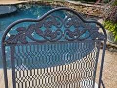 Iron patio table and four spring rocking chairs.