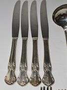 Old company plate flatware possibly Signature Rose pattern. Four dinner forks, four salad forks, five soup spoons, four iced teaspoons, four dinner knives, two serving spoons, one ladle, one cold meat fork, one sugar spoon, and one butter knife. No monogram.  Circa 1940s