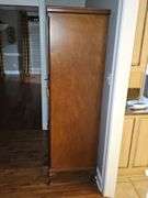 Fabulous antique armoire With burl wood inlay, repurposed as a cabinet. 48 x21.5x 78 in tall.