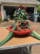 Tote full of Christmas decor and heavy duty tree stand
