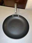 Selection of unmarked small aluminum steamer, 10” Belgique non-stick skillet, Calphalon 10” non-sticker skillet