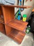 Multi-tiered bookshelf and contents sitting on shelf…..60-1/4 x 16 x 34-1/2…..does have scratching…..BACKGROUND CONTENTS NOT INCLUDED