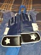 Little cowpoke leather chaps and vest in blue, natural leather color chaps, and pants with fringe and Teepee look on front, cowboy hat and drum.