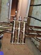 King brand trombone with regular slide and keyed slide. Keys need oil. Mouth mouthpiece included along with music stand.