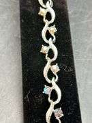 Beautiful vintage silver tone bracelet with sparkling iridescent stones…..7” long…..matching choker is lot 99
