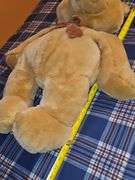 Commonwealth tan teddy bear with bowtie.