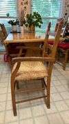 Exquisite custom built table and chairs……custom built in 1972 in Nicosia, Cyprus from oak(?). There are no nails except on the chairs to hold the rush seating in place. Chairs are hand carved…..one small blemish on table top