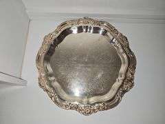Lovely silver plate footed tray. Engraving on underside as shown. 16.5 x 1.5 in tall.