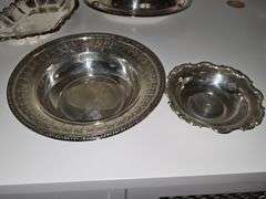 Silver plate bowls, covered dish, and trivets.