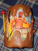 Little cowpoke leather chaps and vest in blue, natural leather color chaps, and pants with fringe and Teepee look on front, cowboy hat and drum.