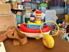 Table full of vintage toys…..Tuggy Tooter does still work, wooden puzzles, Jack-In-The-Box turns but no music nor does he pop out, wooden blocks and more