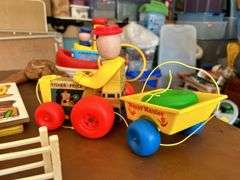Table full of vintage toys…..Tuggy Tooter does still work, wooden puzzles, Jack-In-The-Box turns but no music nor does he pop out, wooden blocks and more