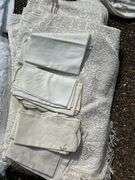 Wide variety of table linens and 1 new bath rug…..sizes unknown