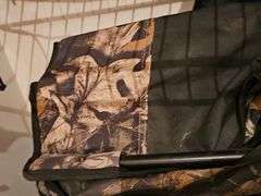Shelf of four quad chairs and a kite.