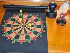 Magnetic dart board (missing 1 red dart), bobblehead Einstein needs battery, and mini Disco light works.