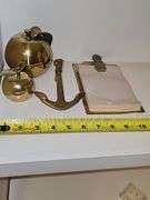 Grouping of brass items. Large apple, small apple, anchor, pineapple note holder.