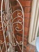 Metal folding trestle with bird finial. 45 in tall