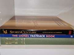 Three totally unrelated books. Sports Century by ESPN, the Lionel Fastrak book, and the world Atlas of wine.
