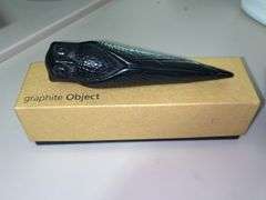 Signed Angelio Batle graphite sculptural writing owl. Natural graphite and smudge resistant compounds are fused in specialized forms…..in original box