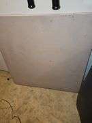 Square card table and box fan.
