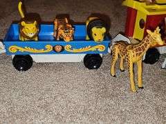 Fisher Price Little people playsets as shown. See all photos. Some pieces have some melting from attic storage as seen on elephant in last photo.