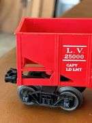 Selection of (2) Lionel Train pieces…..242 Steam Engine (with damage) and Lehigh Valley (L.V. 25000) red rail car