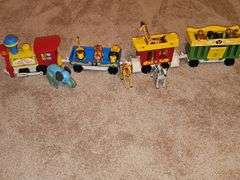Fisher Price Little people playsets as shown. See all photos. Some pieces have some melting from attic storage as seen on elephant in last photo.