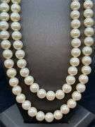 Nice looking double strand of pearl-like beads with adjustable fastener