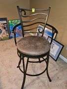 Metal bar stool with padded seat.