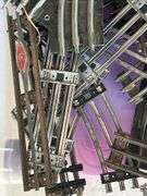 60qt Clear View tub of Lionel O Gauge train tracks, MARX controllers, bridge, trestle…..there is rust and guarantees that set is complete….please see all pics, especially seller’s pic of complete setup