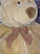 Commonwealth tan teddy bear with bowtie.
