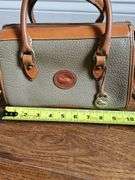 Dooney & Bourke handbag with shoulder strap.