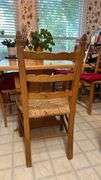 Exquisite custom built table and chairs……custom built in 1972 in Nicosia, Cyprus from oak(?). There are no nails except on the chairs to hold the rush seating in place. Chairs are hand carved…..one small blemish on table top