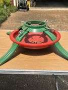 Tote full of Christmas decor and heavy duty tree stand