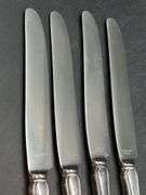 (4) Sterling Dinner Knives with Sterling handle and stainless blade……maker is not visible on back…..needs polished