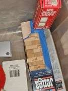 Three vintage Mickey mouse characters, board game Clue, miniature air hockey game untested,  poker chips and cards, and Jenga.